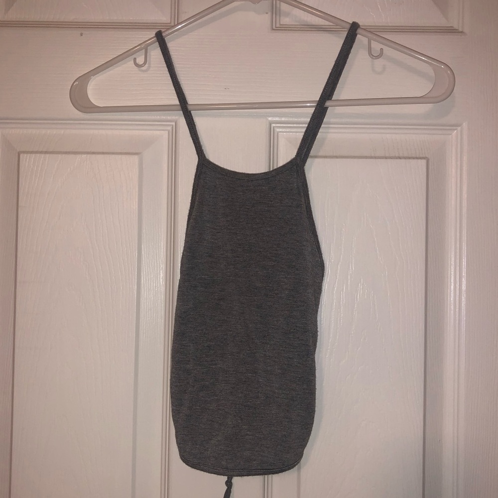 Gray crop top tied in back that cross crosses
